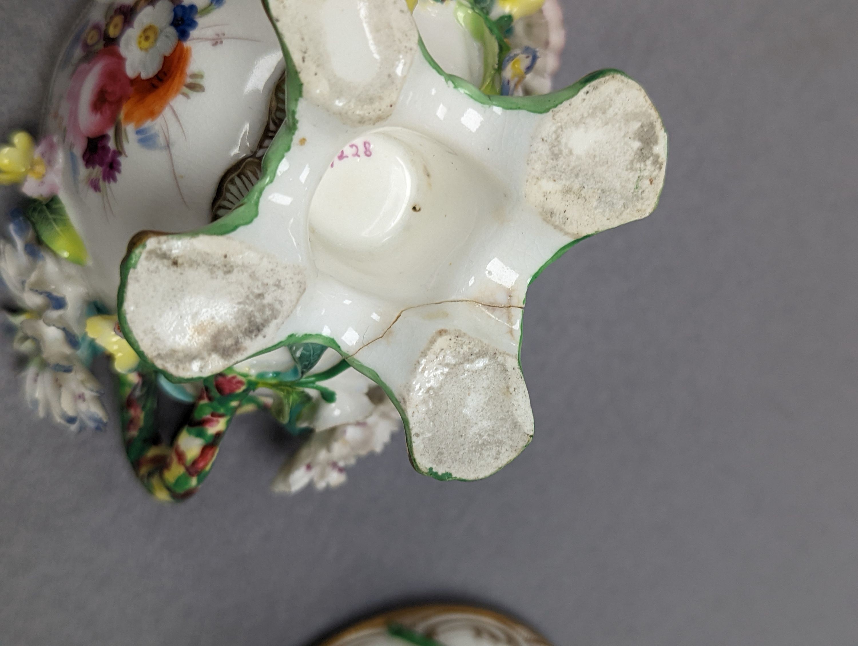 An 18th century Mennecy porcelain cup and cover, a Meissen style cup and cover, an English porcelain floral encrusted double inkwell and cover and a similar jar and cover